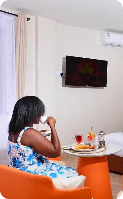 Guest relaxing in cottage room at Bustani Tulivu Western Kenya